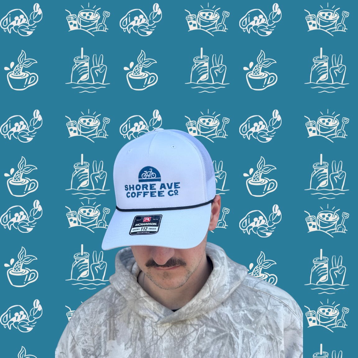 Shore Ave white trucker hat on a guy