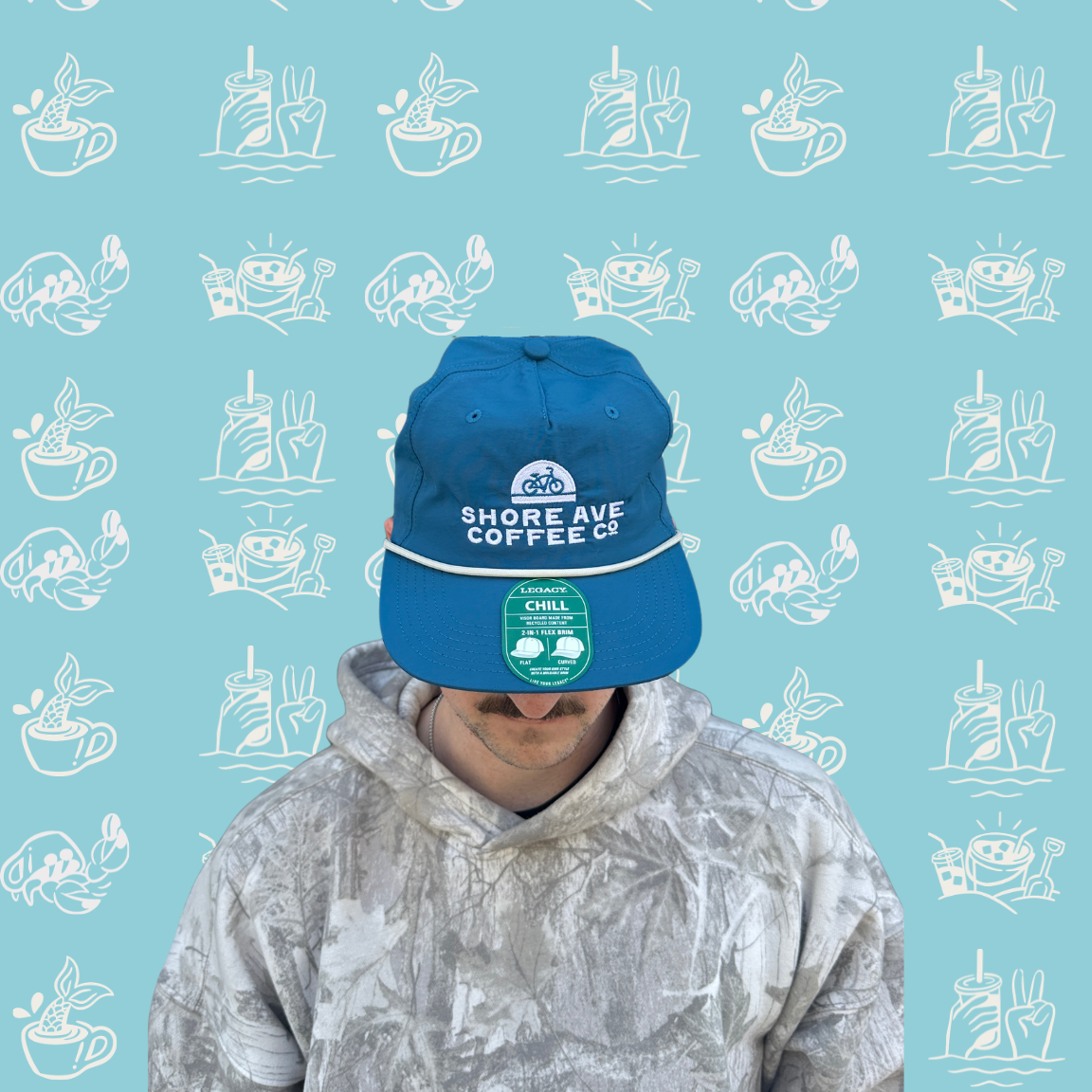 Person wearing a blue cap with a logo on a light blue background with boat patterns